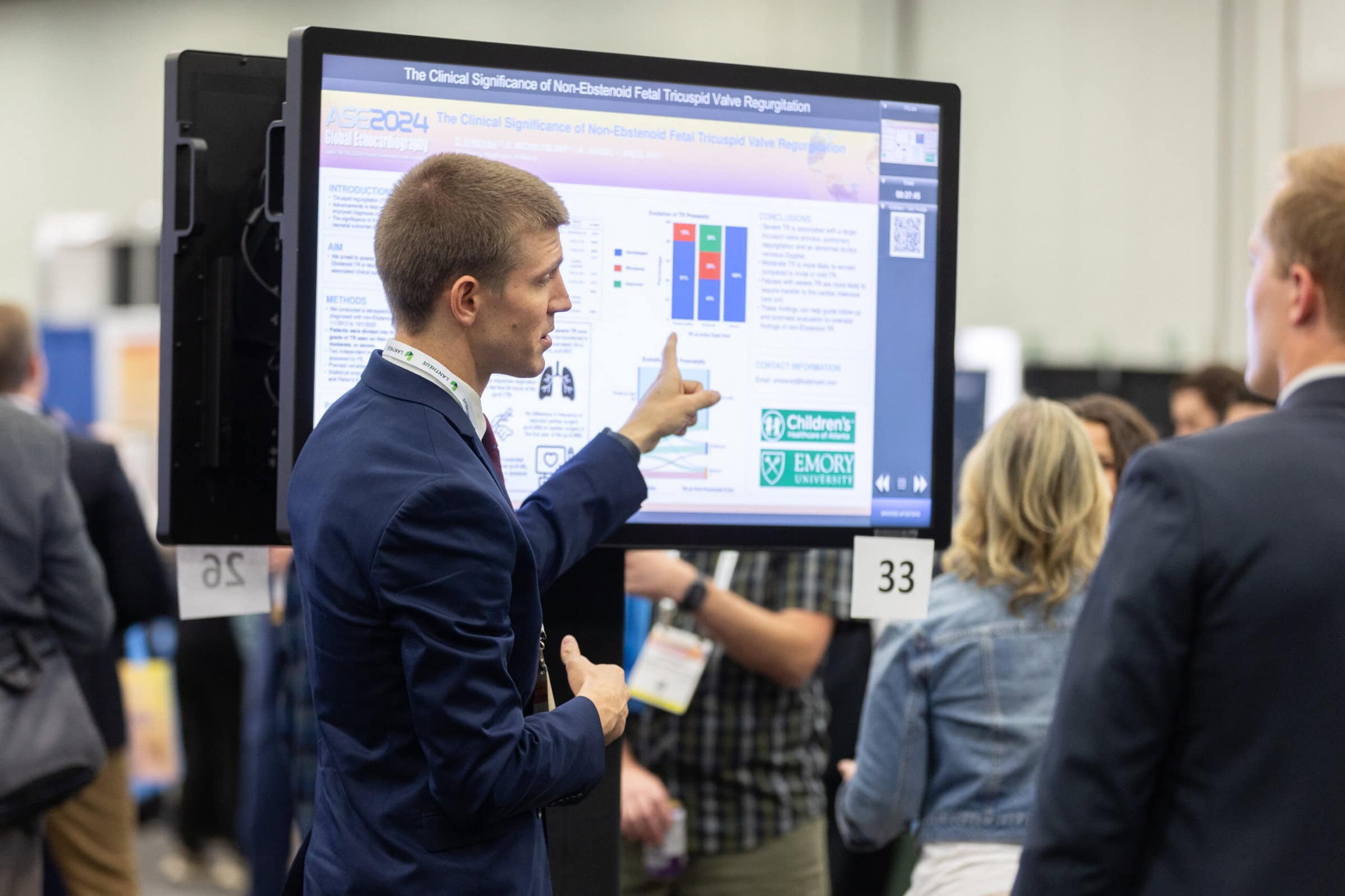 ASE 2024 6-14-24 - Tom Cook Photo-337 A student presenting his research proposal at a booth